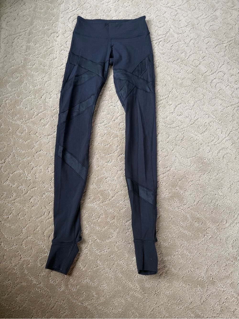 Size 4 Lululemon Black Leggings with fabric that goes around feet